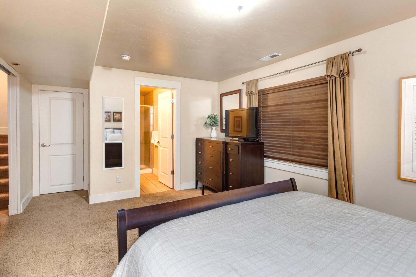 Settle into your comfortable bedroom with plush carpeting, warm wood furnishings, and thoughtful touches that make unwinding feel effortless.