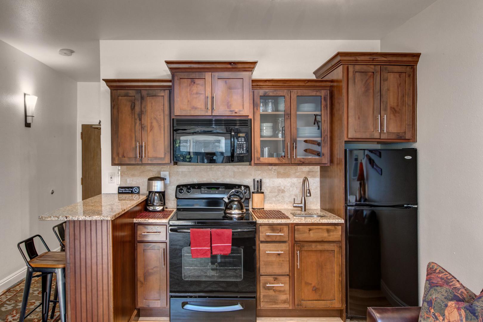 Fully Equipped Kitchen: "Modern appliances and ample storage in sleek kitchen design."