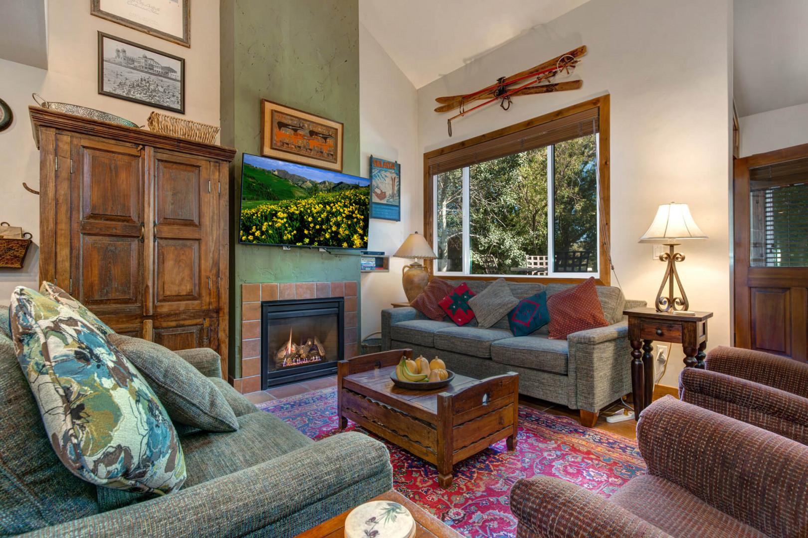 Cozy sofa set by the gas fireplace, overlooking the window and TV.