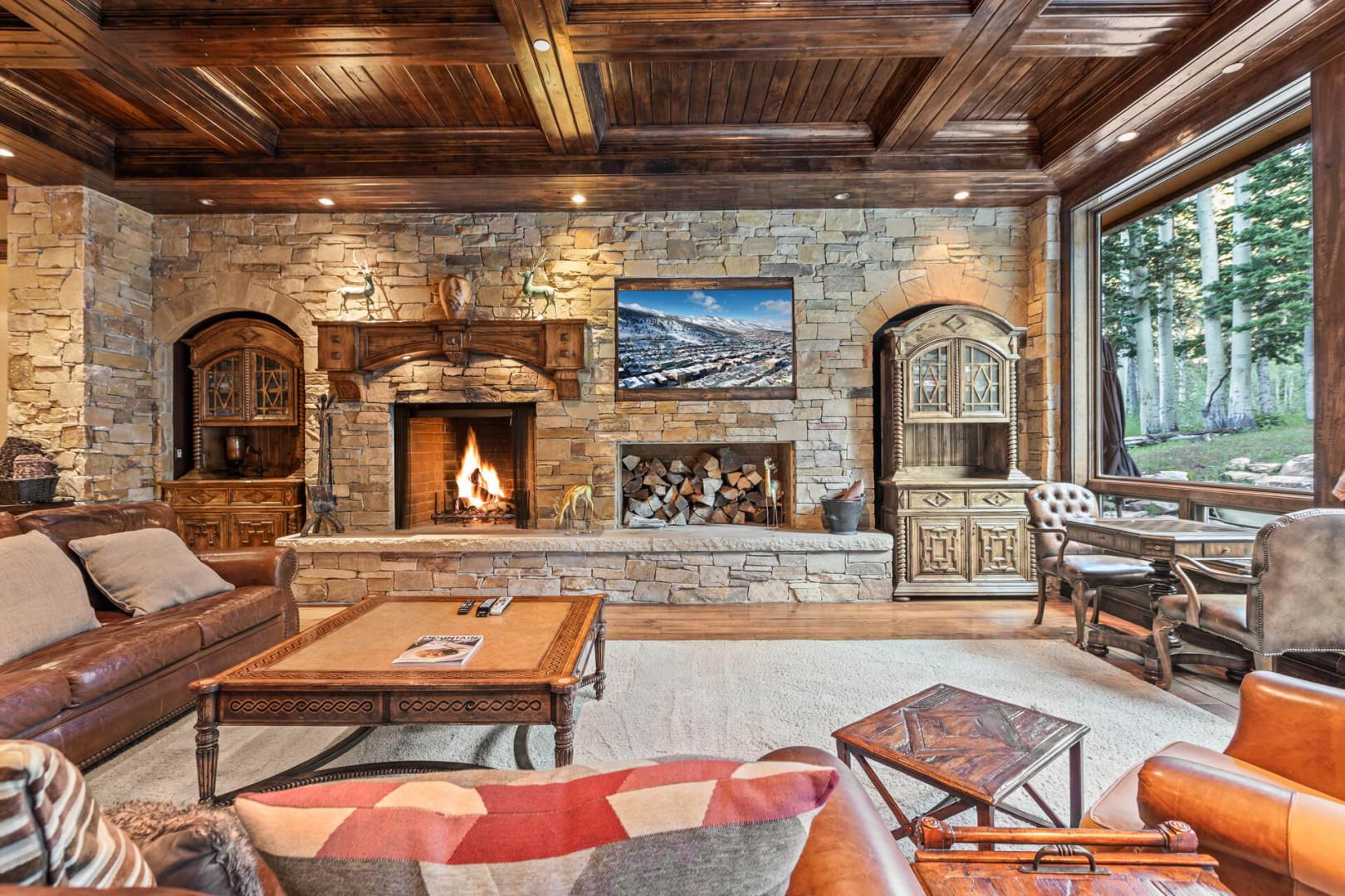 Cozy ambiance with a stylish sofa set and a warm fireplace.