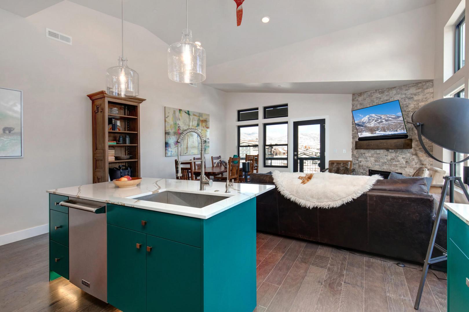 Sparkling clean kitchen sink in a spacious, well-lit cooking area.