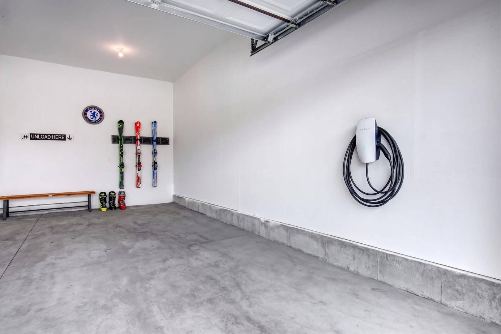 Convenient garage parking with dedicated storage hooks and an electric vehicle charging station keeps your gear organized and your car ready for adventure.