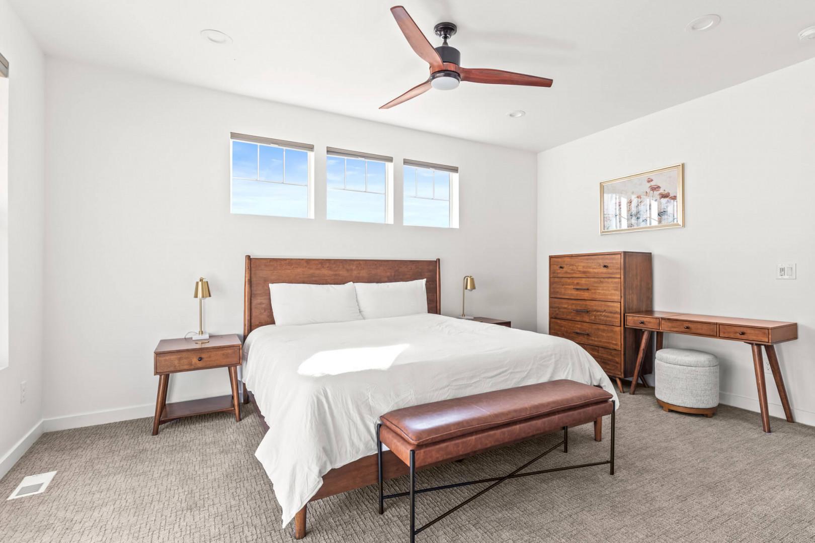 Drift into restful sleep in your bright, modern bedroom with plush linens and mid-century furnishings—your serene retreat after days exploring.