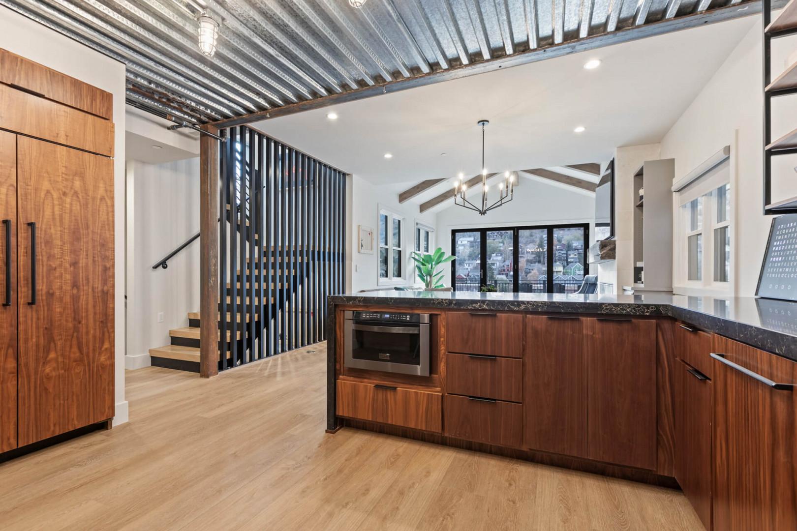 Rustic stairs with wooden partitions leading to cozy culinary delights.