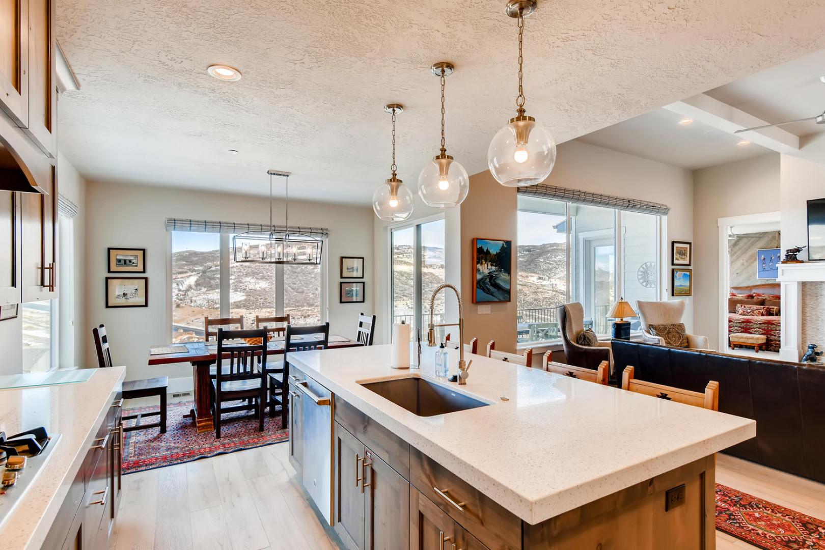 Jordanelle Estates 13299: Sparkling clean kitchen sink in a spacious, well-lit cooking area.