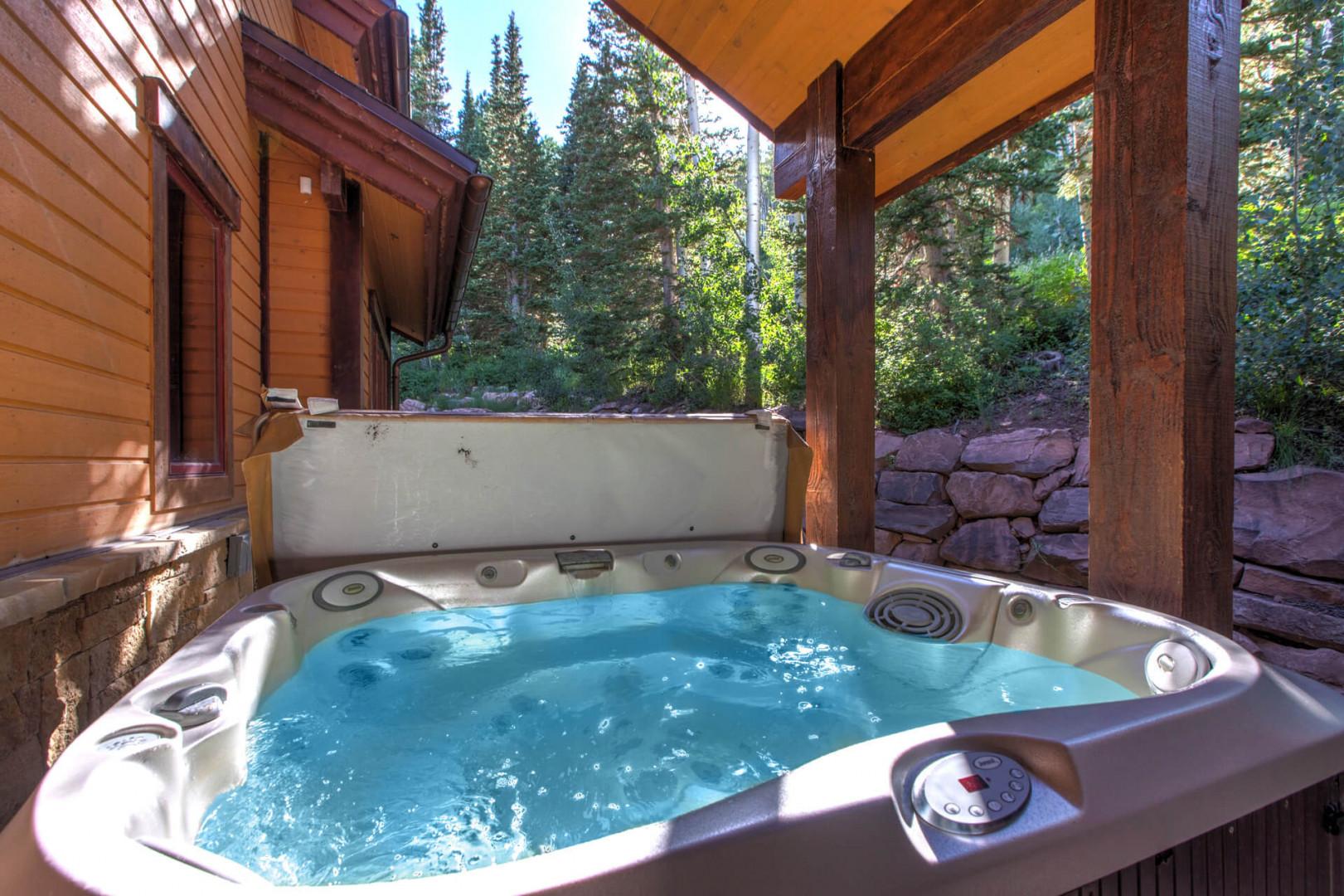 Outdoor Hot Tub: "Serene escape nestled among trees, perfect for relaxation and rejuvenation.