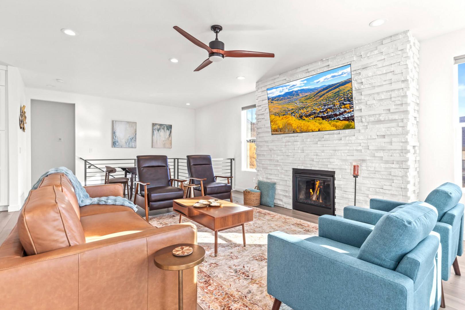 Sink into stylish comfort in your spacious living room, where contemporary furnishings, a cozy fireplace, and mountain views create the perfect retreat after exploring.