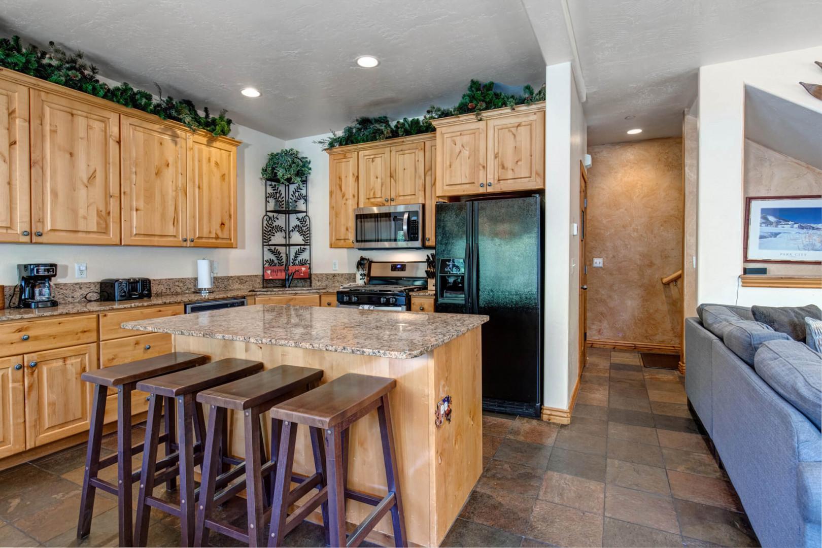 Bear Hollow Lodges 5474: Modern appliances and ample storage in sleek kitchen design.