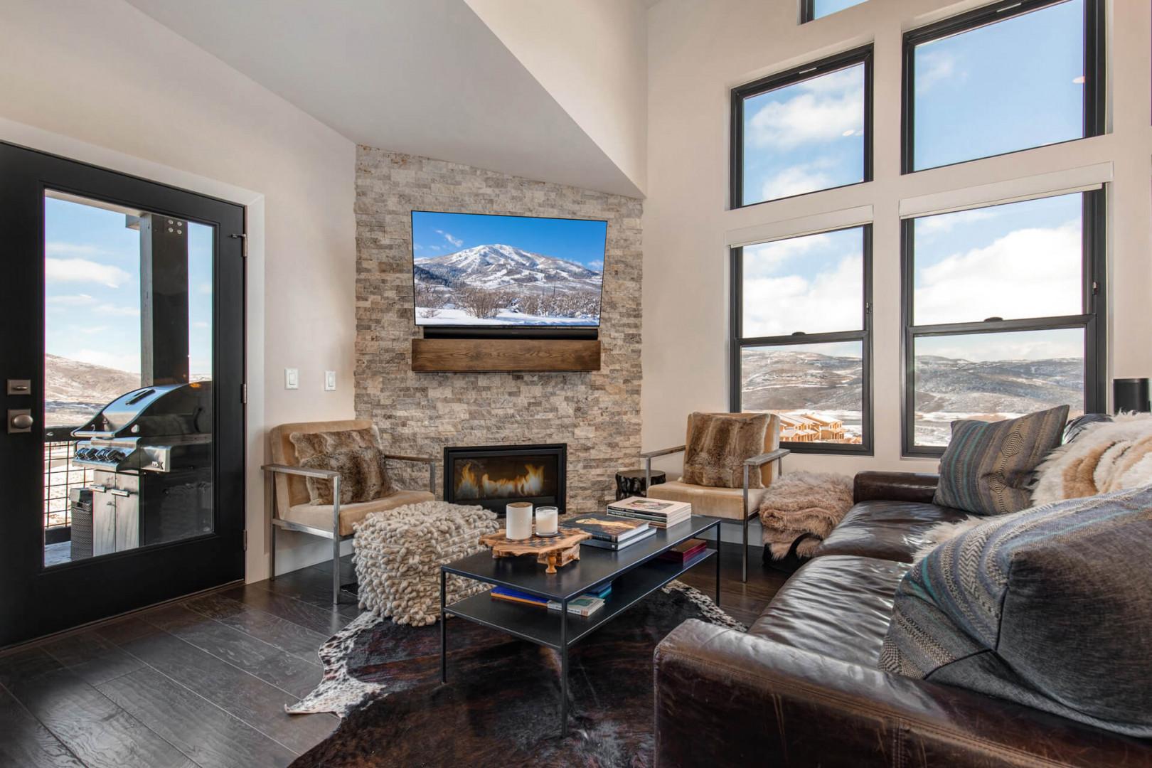 Living Room: "Cozy space with a fireplace, TV, and stylish sofa set."