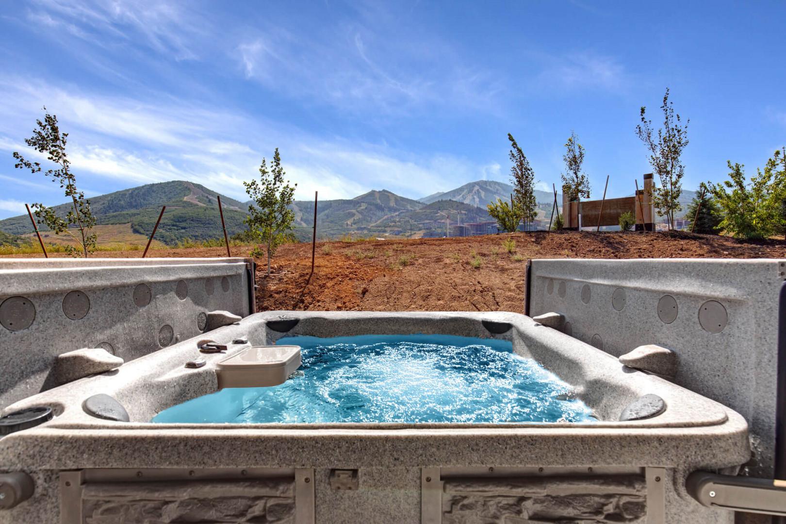 Soak away tension in your private hot tub with sweeping mountain vistas under wide-open skies—your own outdoor sanctuary for pure relaxation.