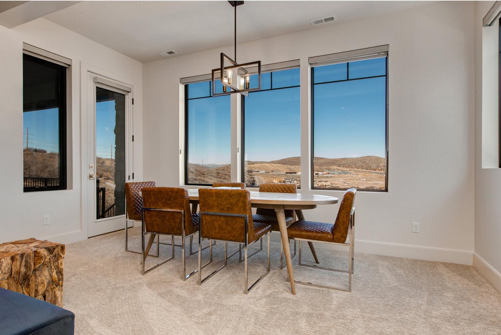 Jordanelle Estates 13201: Dining table: "Sunlit space with a view, perfect for family meals and gatherings."