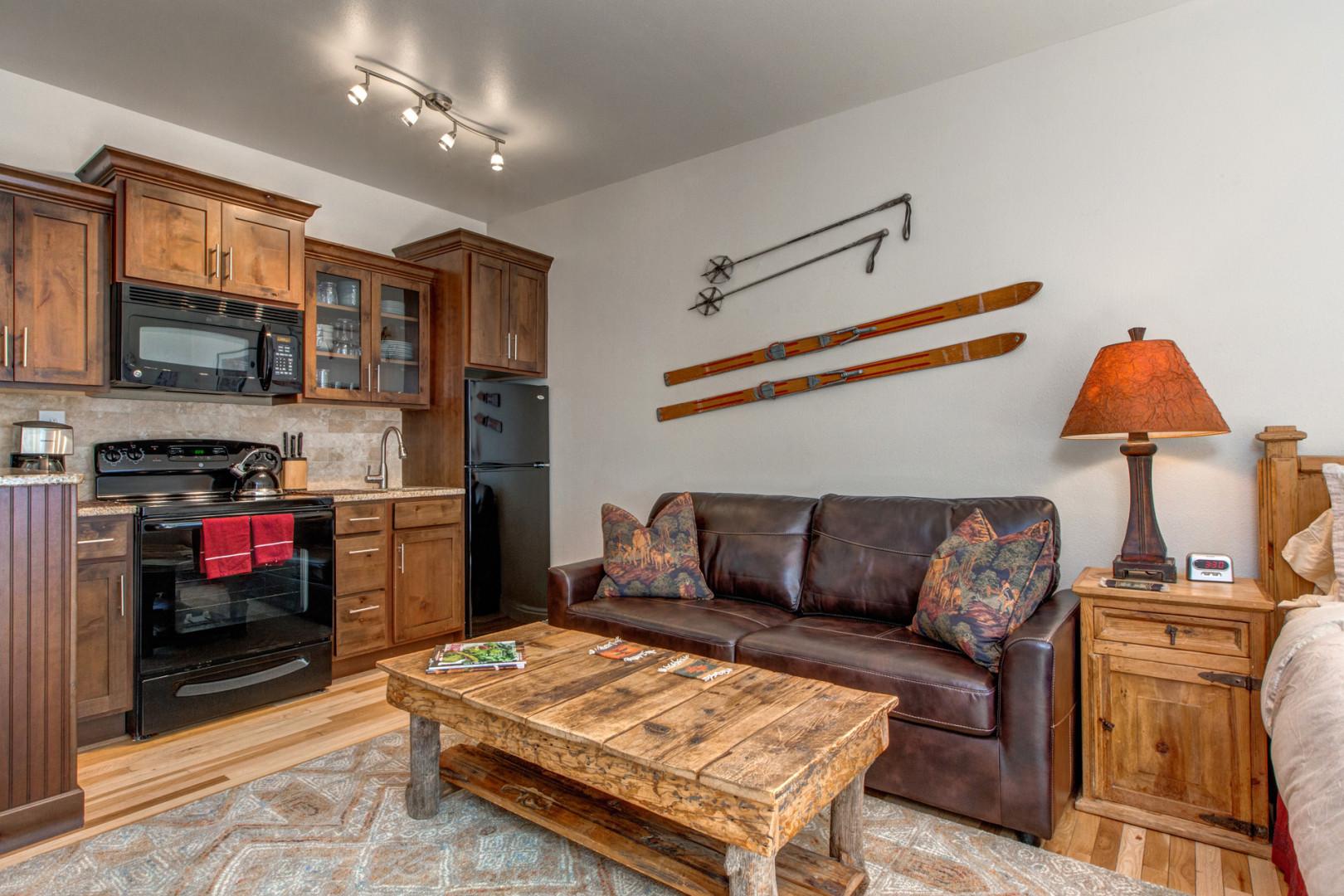 Cozy sofa bed and center table by the kitchen.