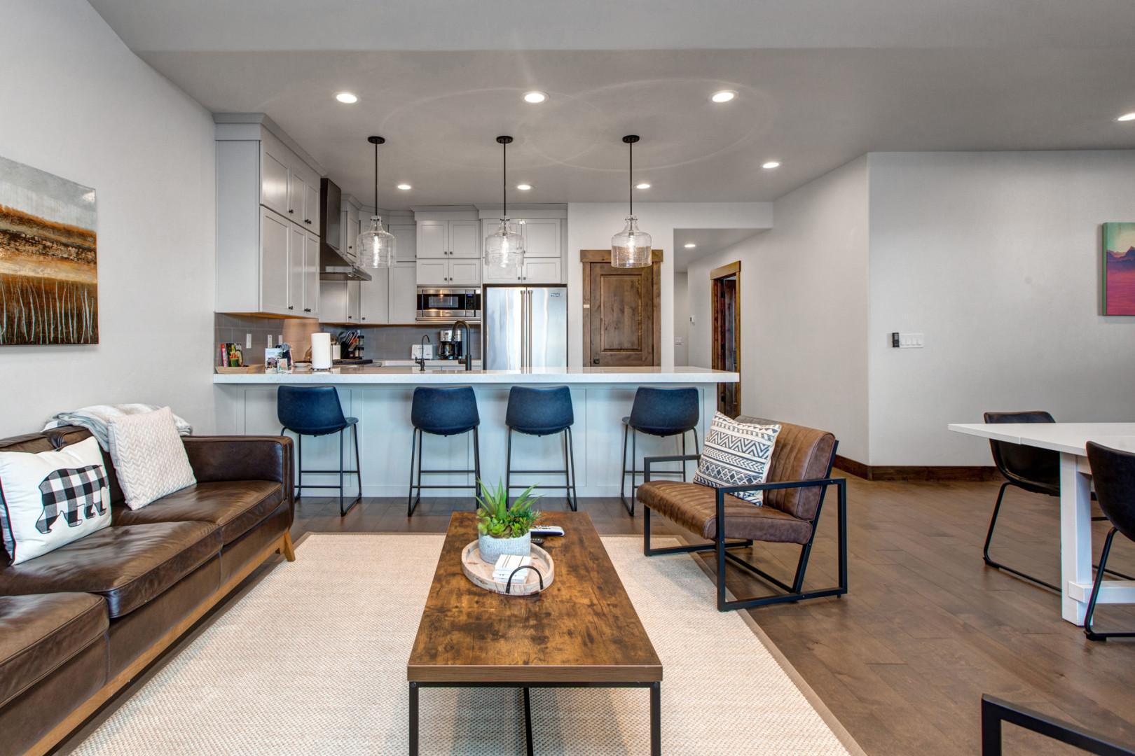 Black Rock Ridge 14494: Cozy sofa set, and dining table, with a glimpse of the kitchen.