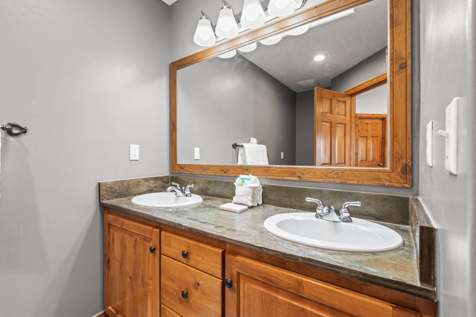 Bear Hollow Village 5458: Ensuite bathroom of the primary bedroom has a double vanity and a step-in shower.