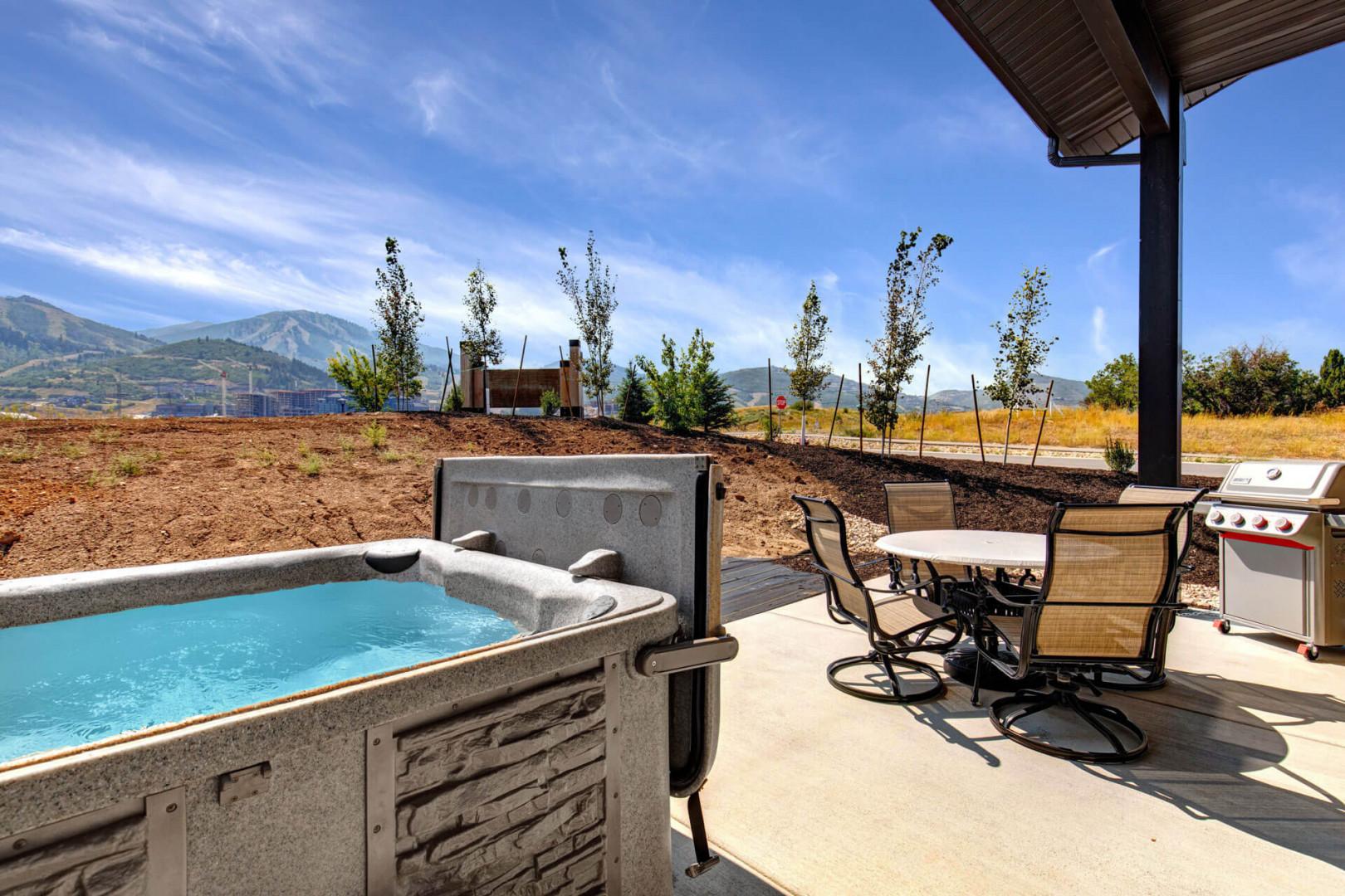 Unwind in your private hot tub while mountain views stretch across the horizon, or fire up the grill and dine al fresco on the covered patio—your perfect outdoor retreat awaits.