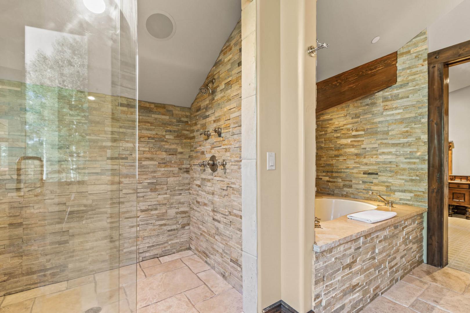 Inviting shower area and relaxing bath tub.