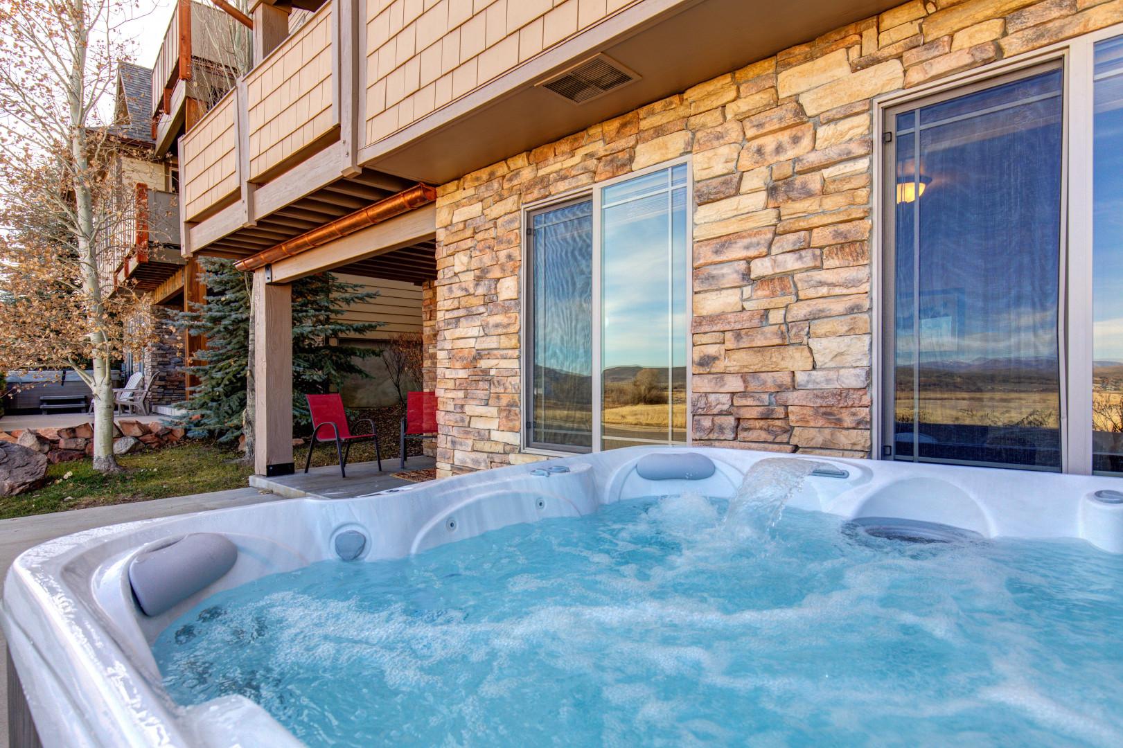 Outdoor Hot Tub: "Relaxing soak under the stars, a perfect way to unwind."