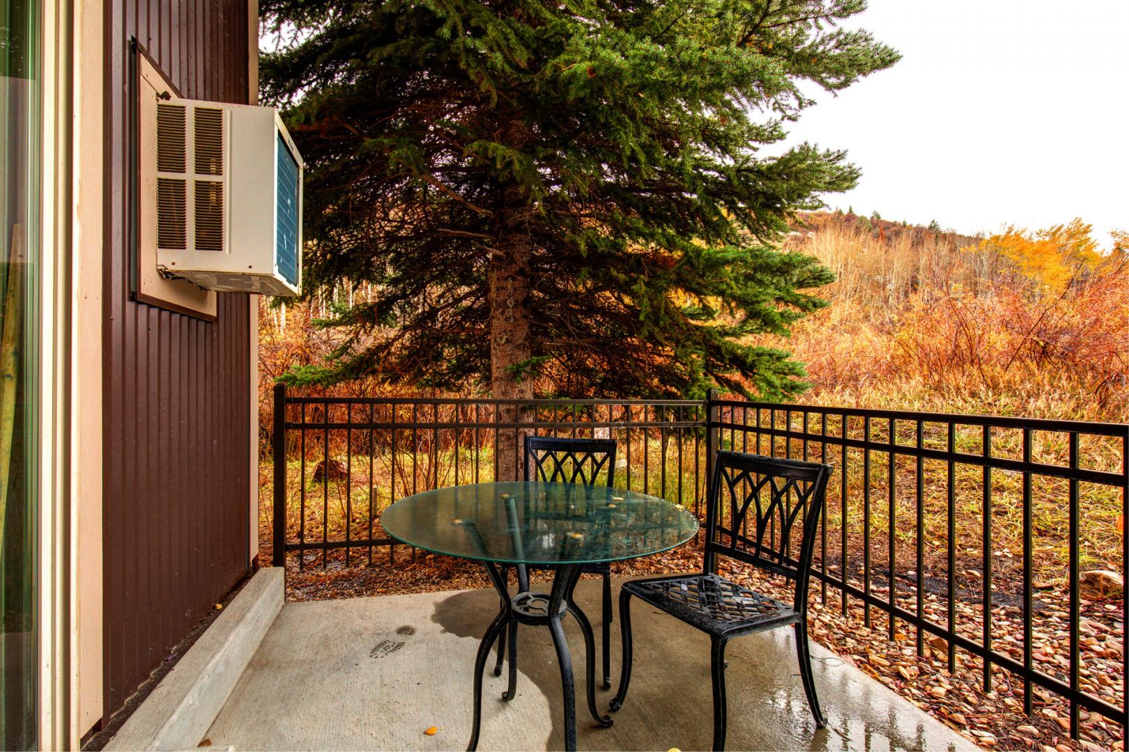 Inviting space with a table and chairs for relaxation and enjoyment.