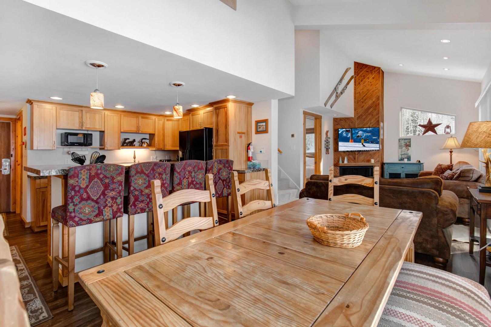 Chic bar stools, modern dining table, and chairs in stylish setting.