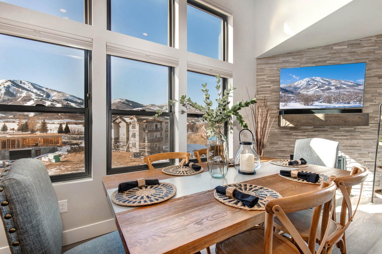 Natural light illuminates the elegant dining table by the window.