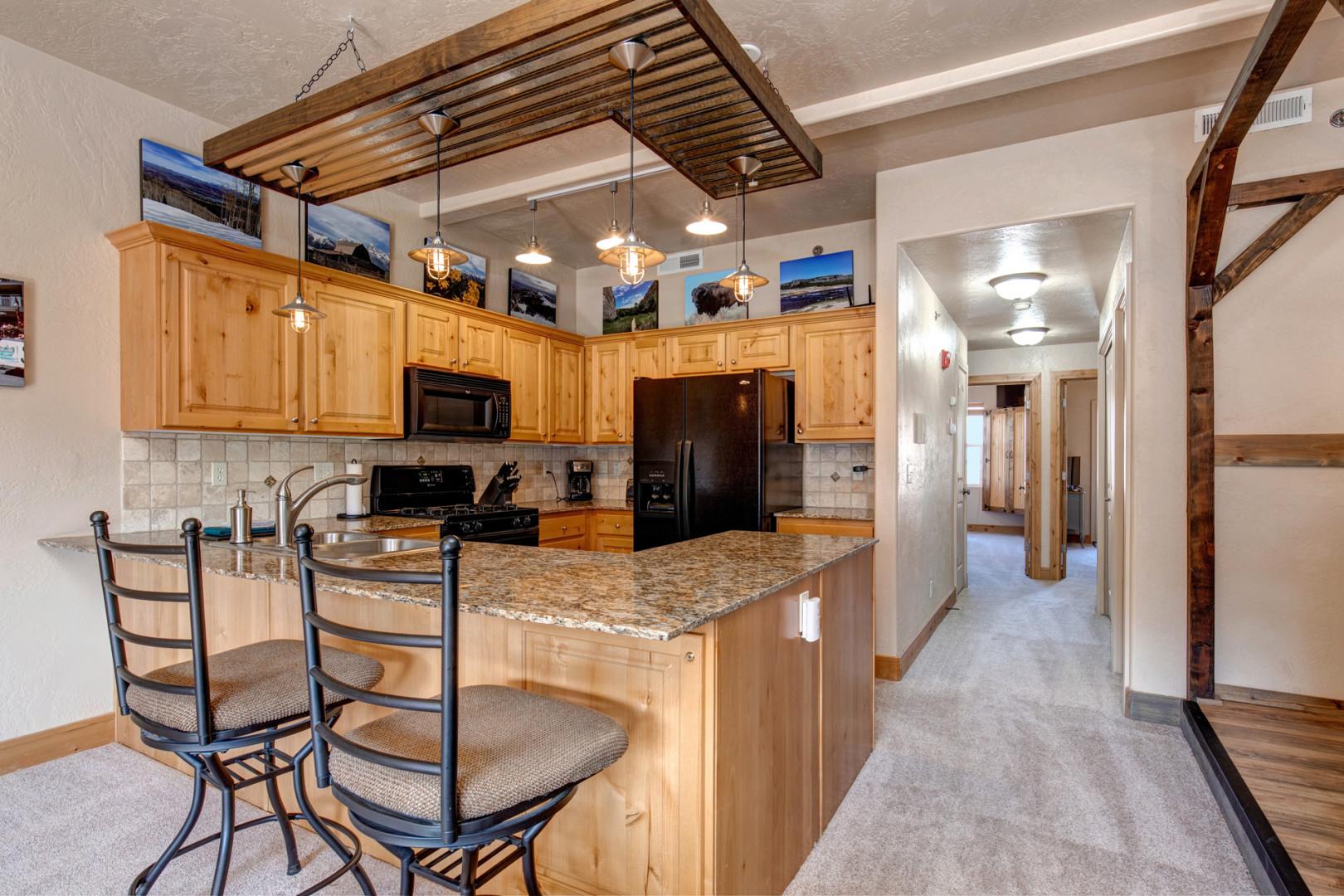 Foxpoint 1684-H3: Modern bar stools add a stylish touch to this sleek kitchen.