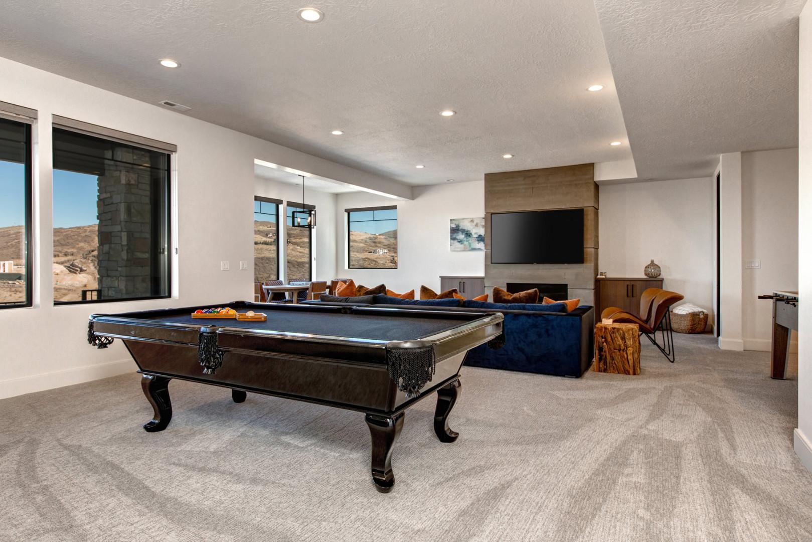 Jordanelle Estates 13201: Sofa adjacent to pool table for leisurely evenings.