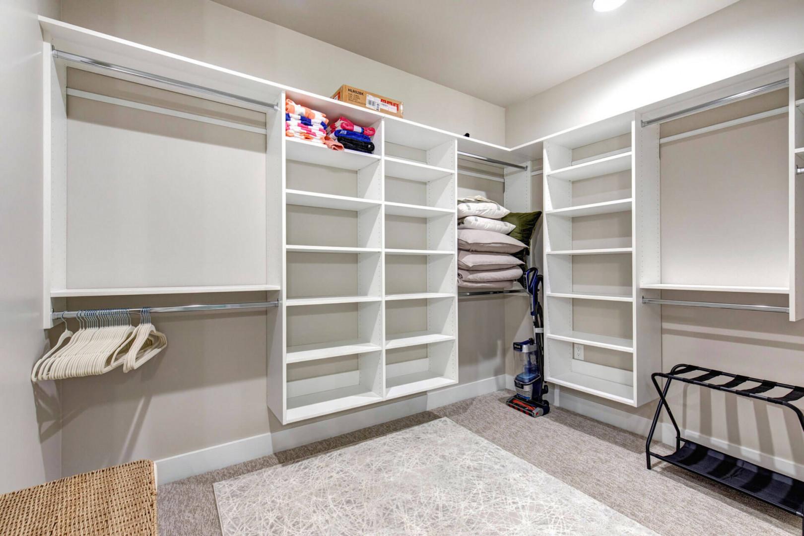 Your spacious walk-in closet offers abundant storage with custom shelving and double hanging rods, providing all the room you need to unpack and settle in.