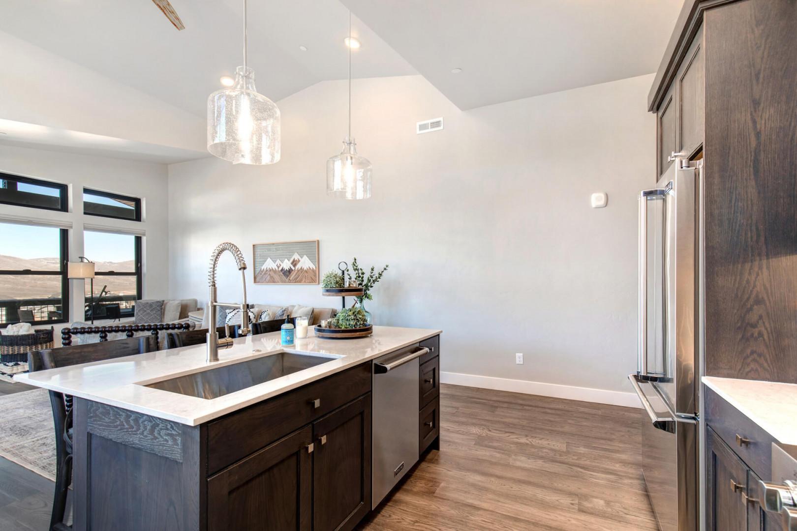 "Sparkling kitchen sink in a spacious and well-organized cooking area."