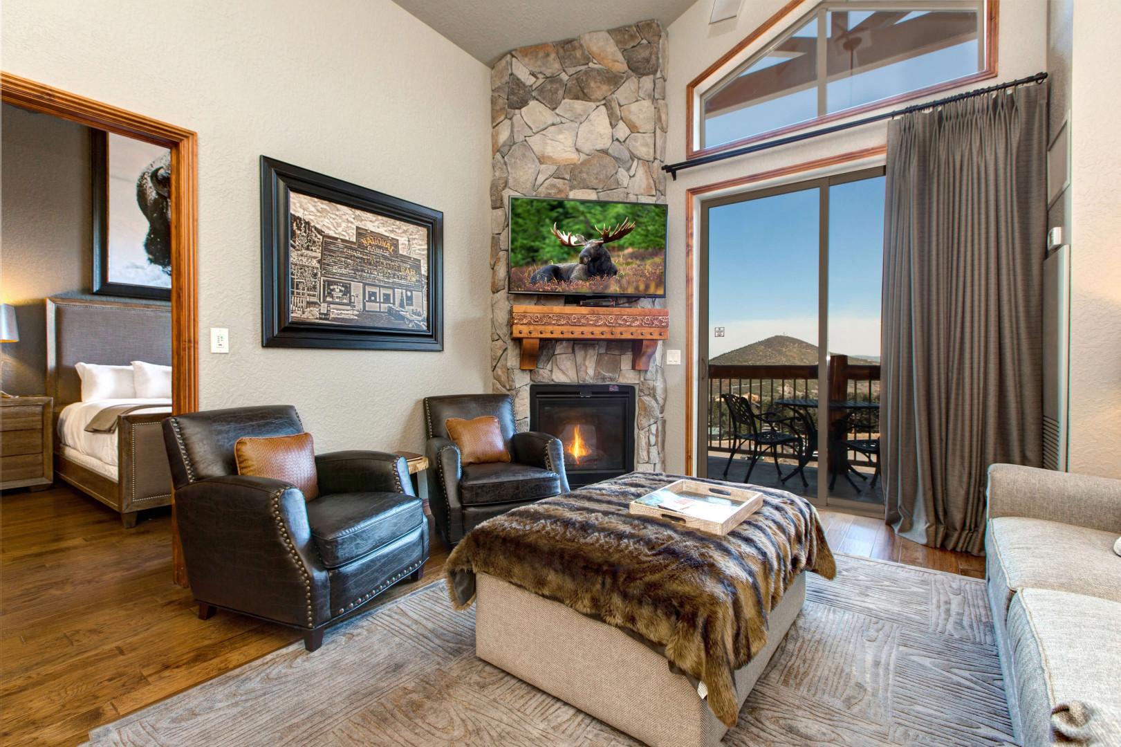 Cozy space with a gas fireplace, sofa set, and outdoor patio.