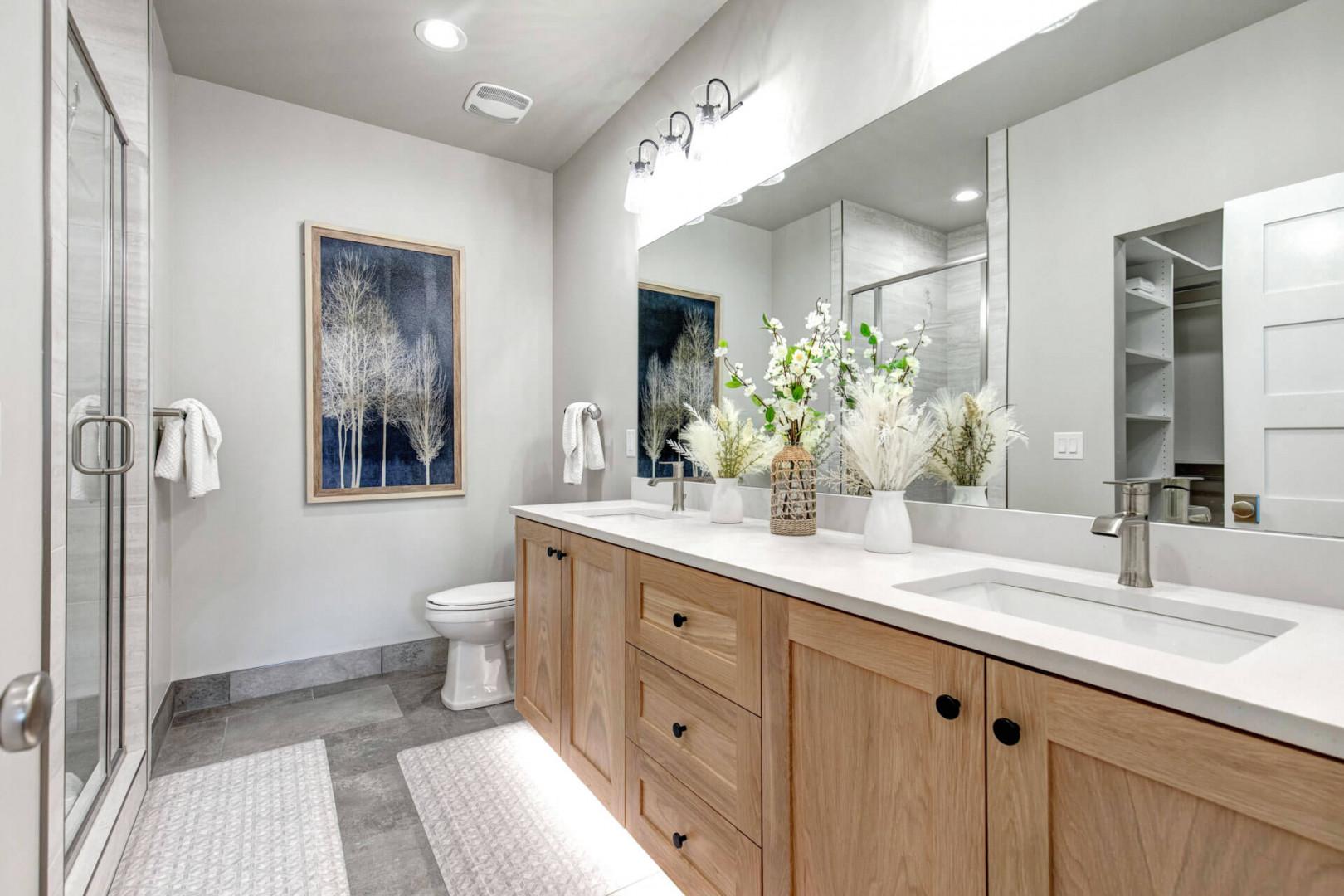 Step into your serene private sanctuary, where warm wood tones meet crisp white surfaces and soft neutral hues create the perfect retreat after a day of adventure.