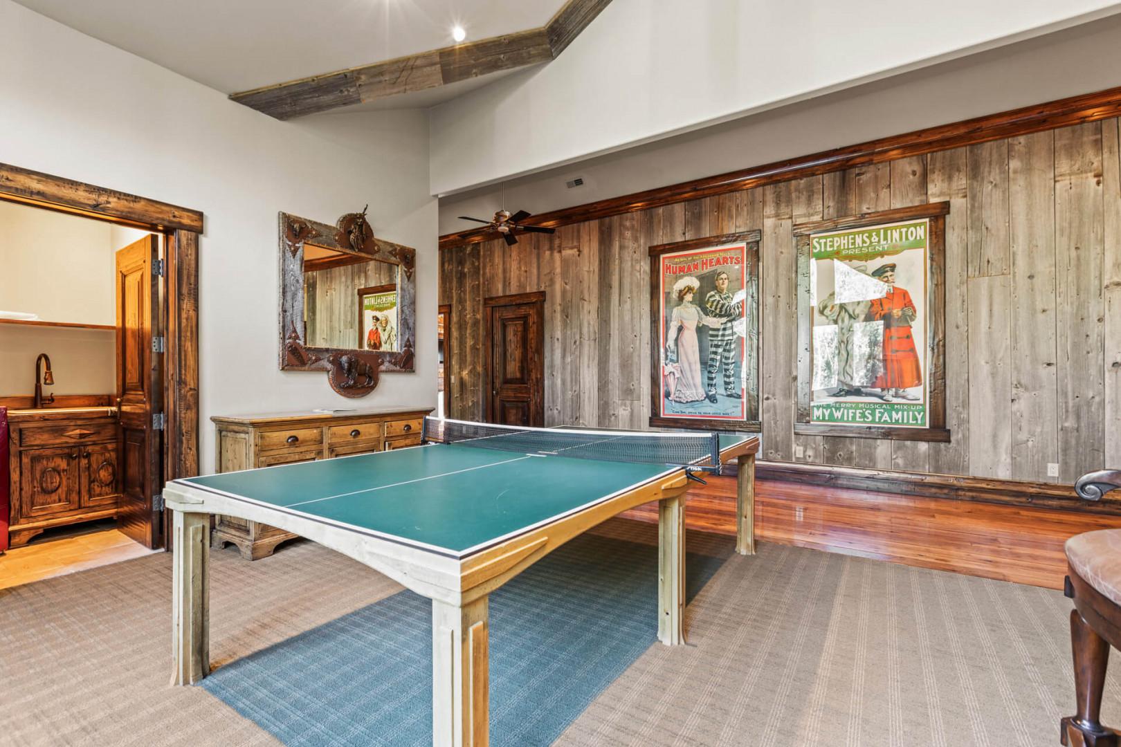 Table tennis by the windows, inviting a friendly competition.