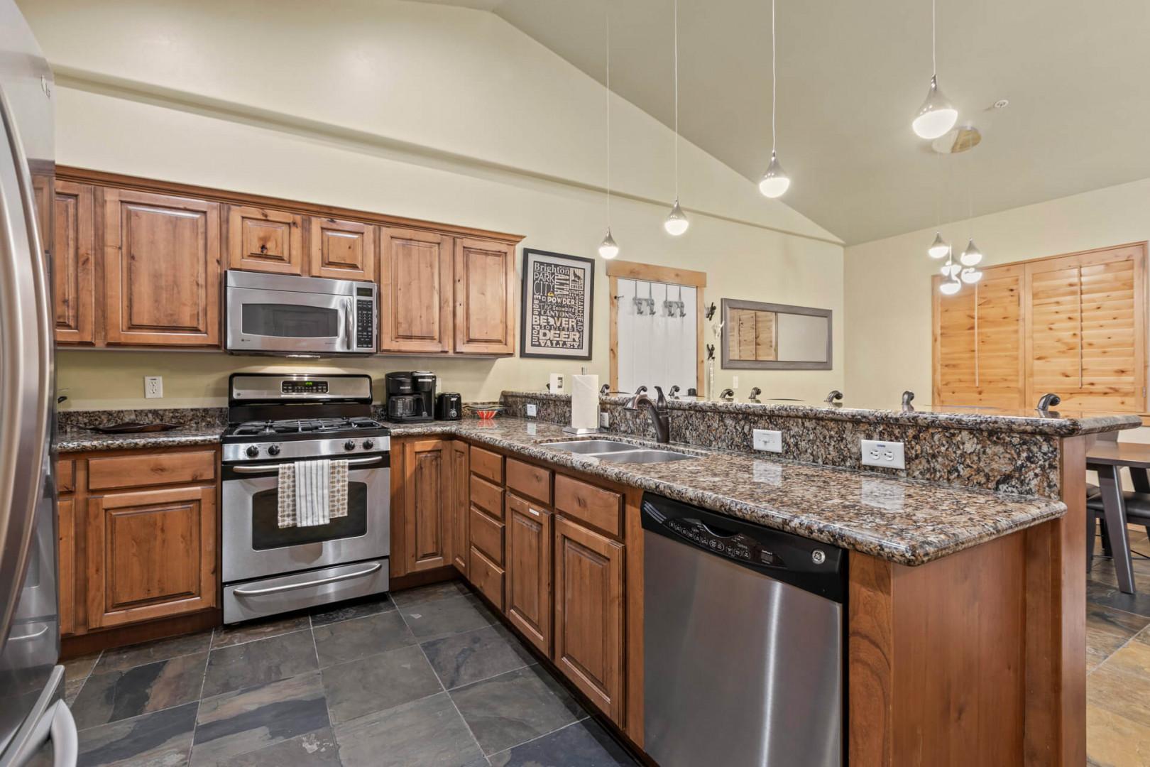 Bear Hollow 1404: Modern appliances and ample storage in sleek kitchen design.