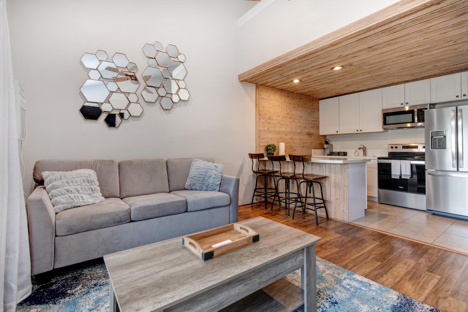 Cozy seating with a stylish kitchen bar for casual dining.