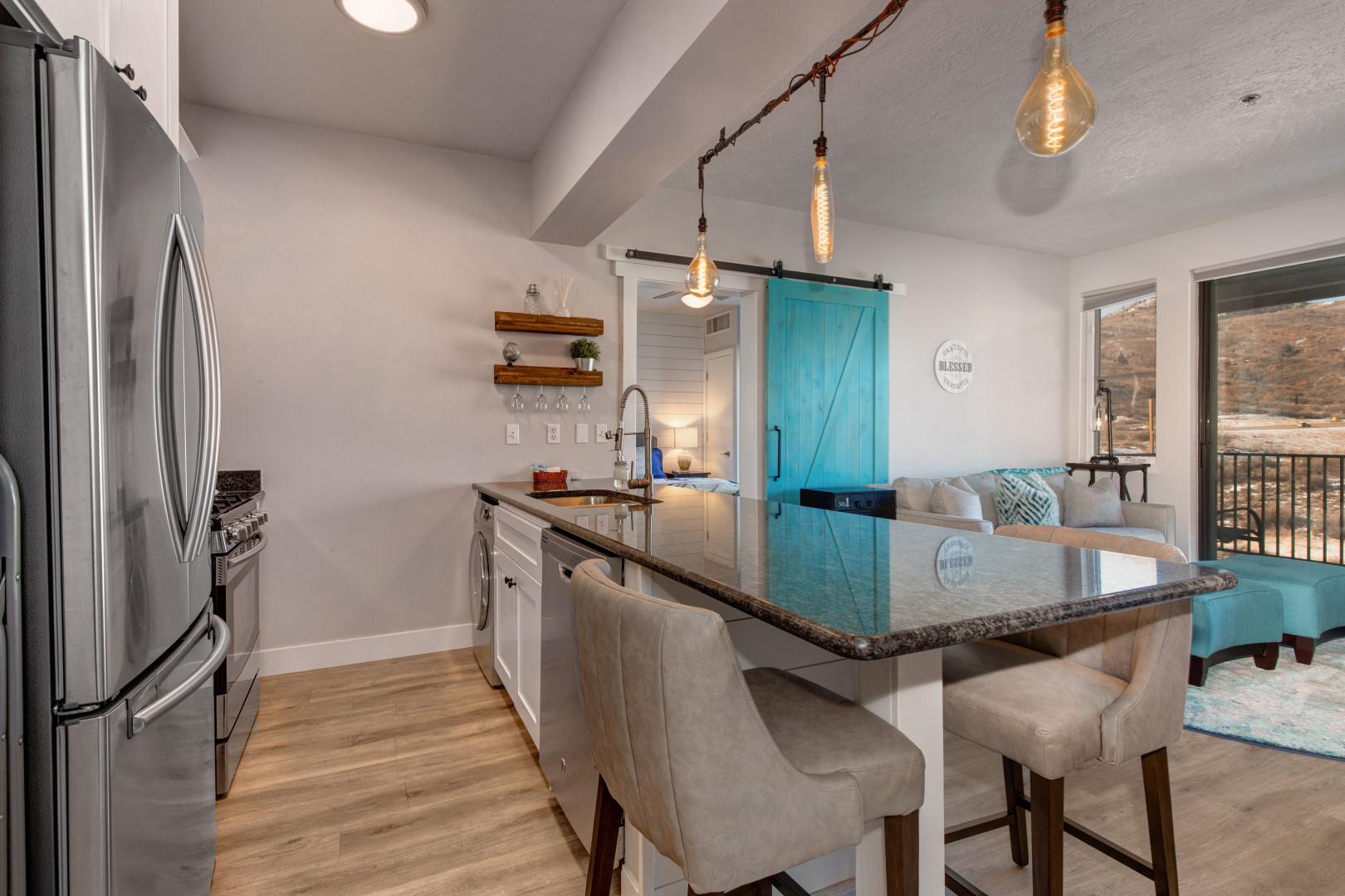 Stillwater 3067: Modern kitchen with sleek countertop, sink, and trendy bar stools.