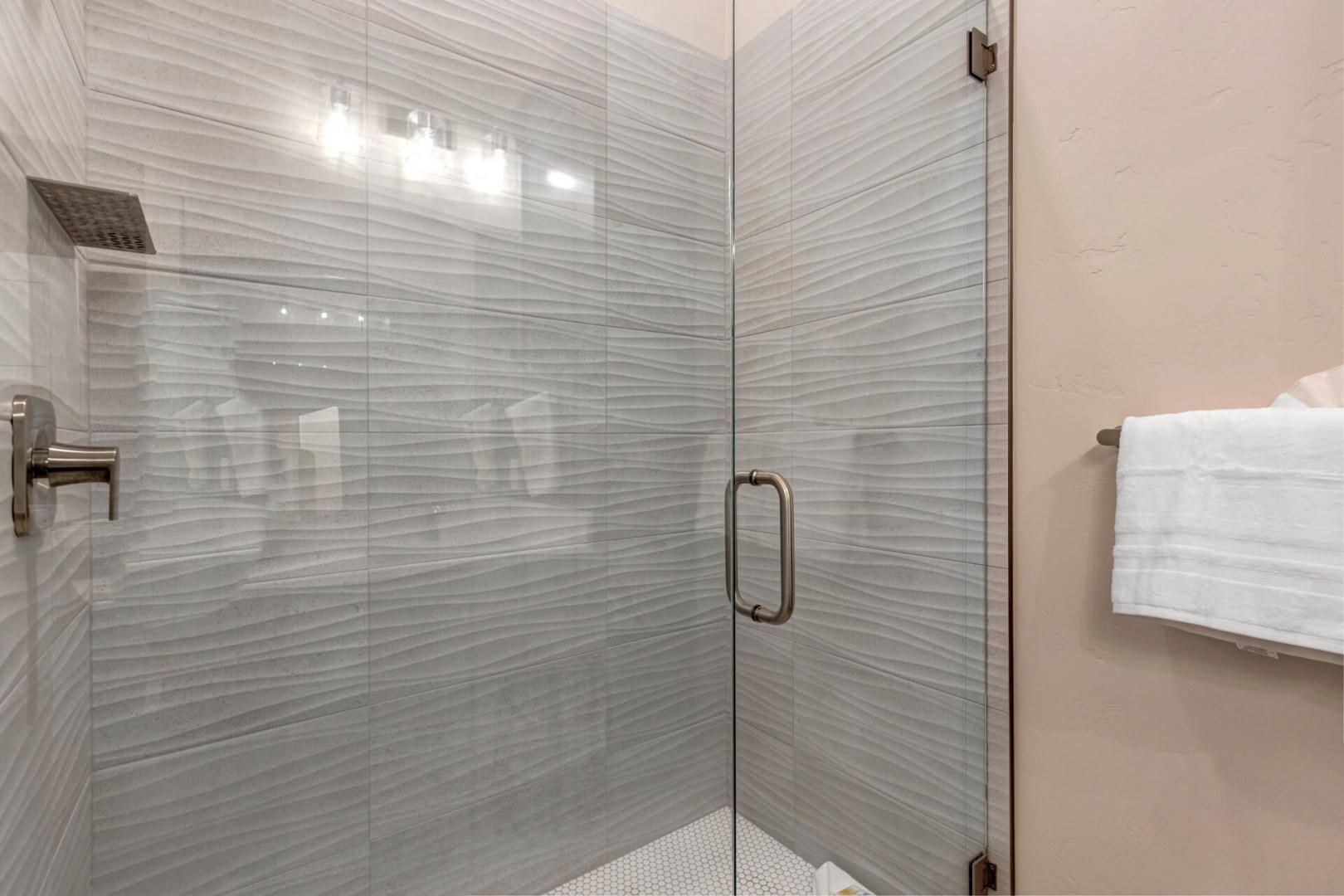 Modern shower with sleek glass enclosure, a perfect oasis for relaxation.