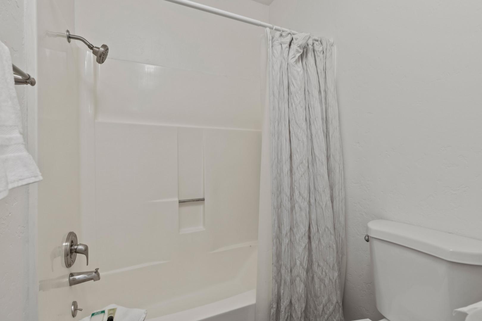 Relaxing soak awaits in this convenient tub shower combo.