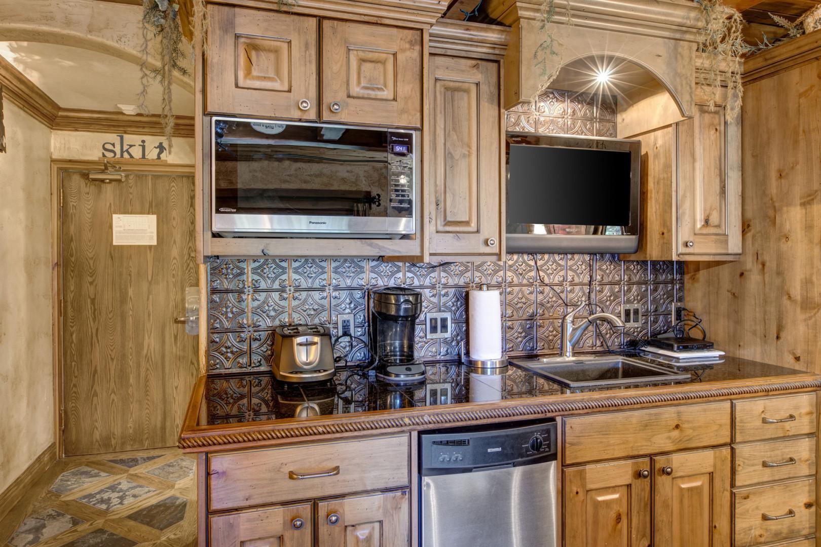 Modern appliances and ample storage in sleek kitchen design.