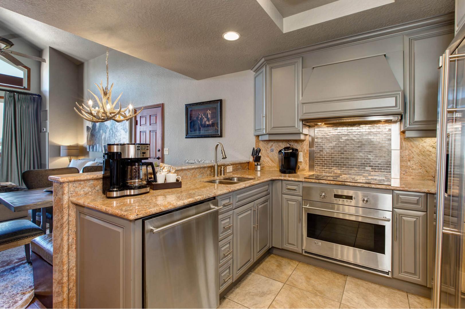 Modern appliances and ample storage in sleek kitchen design.