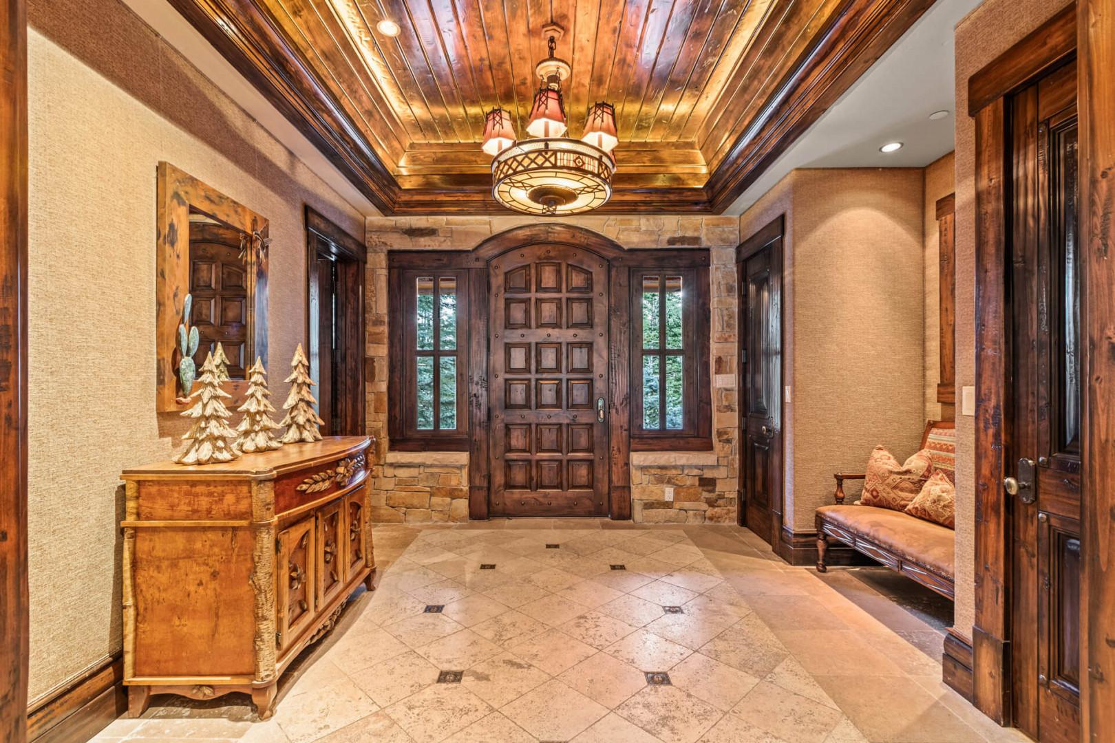 Elegant chandelier above a cozy sofa in the receiving area.