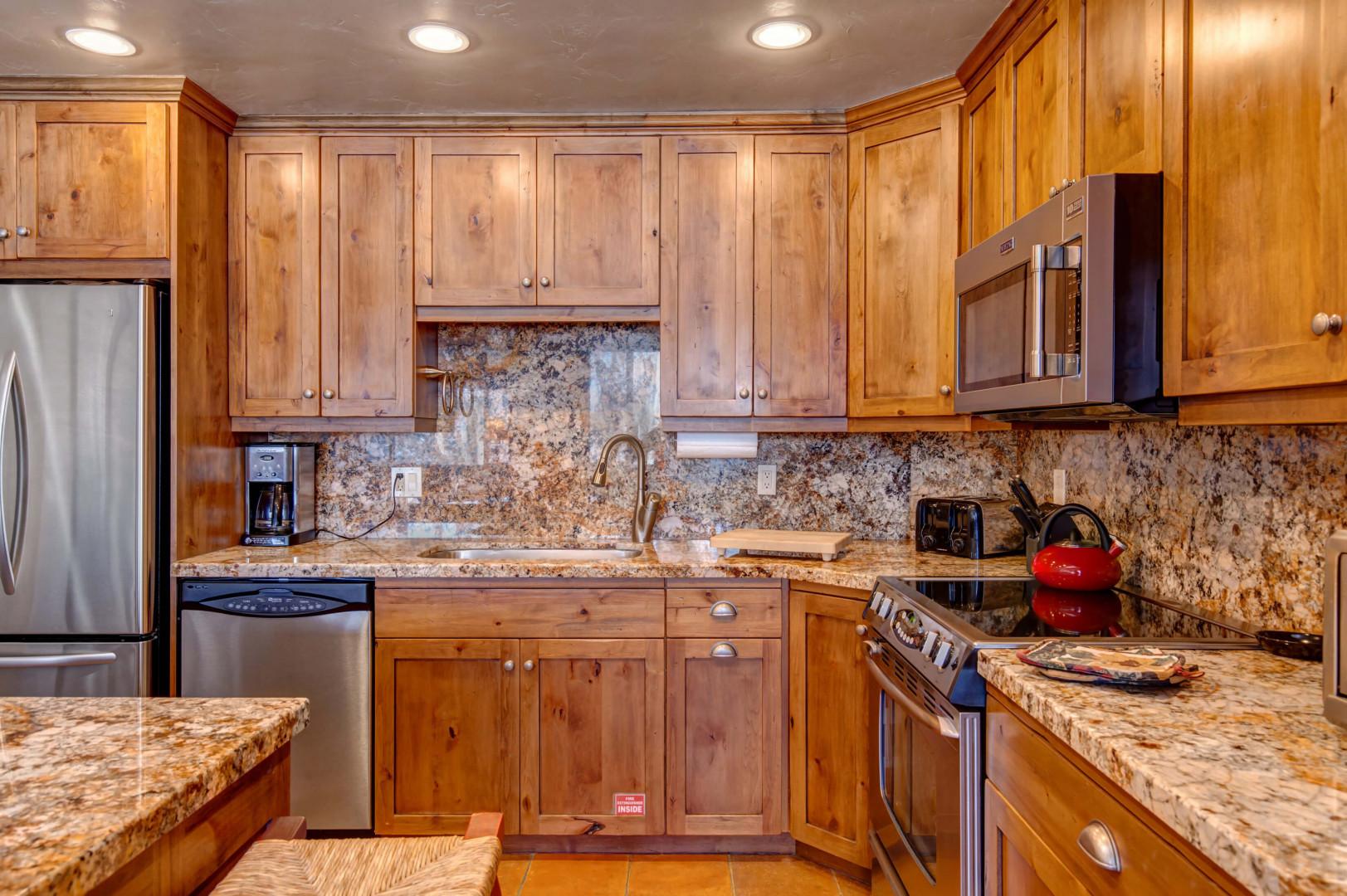 Wood cabinets, & kitchen tops - a cook's paradise.