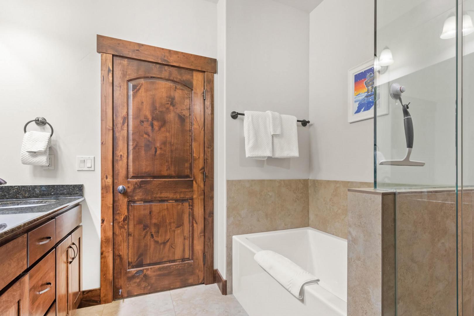 Unwind in your elegant ensuite with a deep soaking tub and spacious glass shower after mountain adventures.