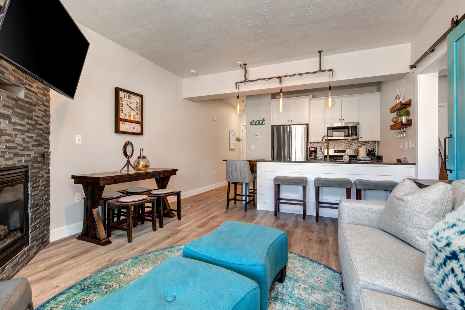 Stillwater 3067: Cozy sofa set, and dining table, with a glimpse of the kitchen.