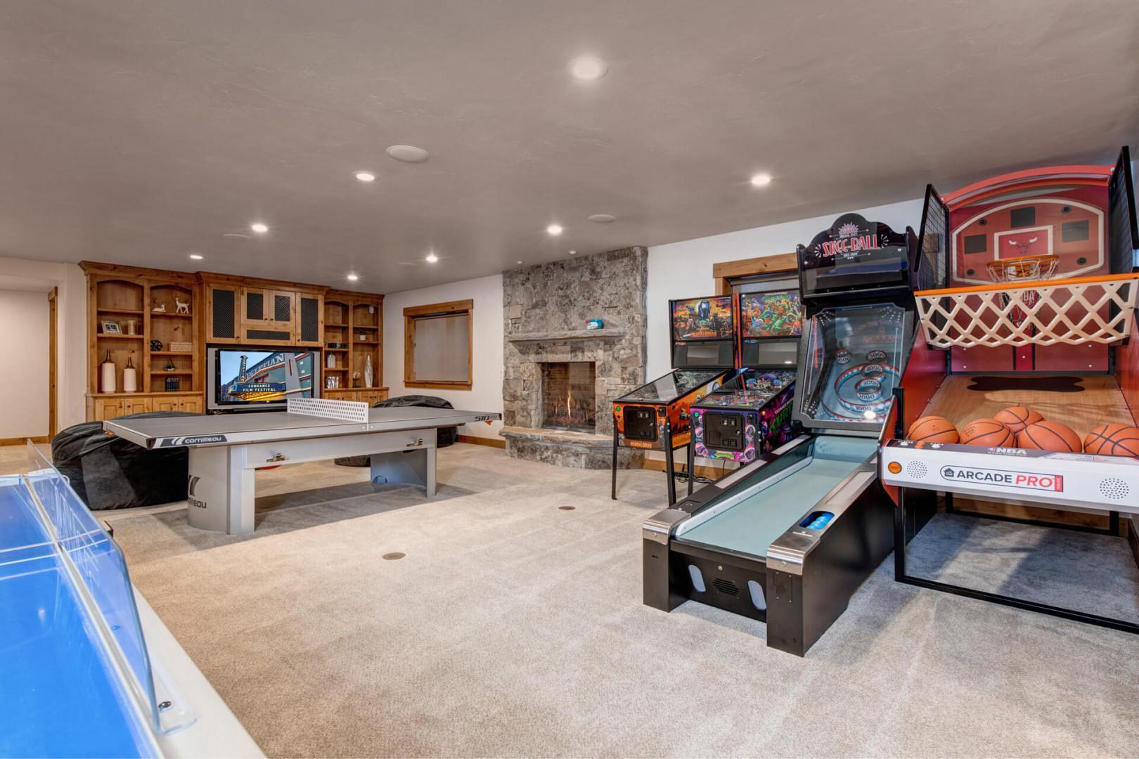 "Cozy space with table tennis, fireplace, and arcade games."