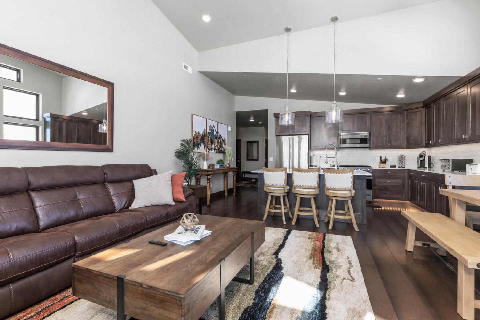 Cozy sofa set with a glimpse of the kitchen.