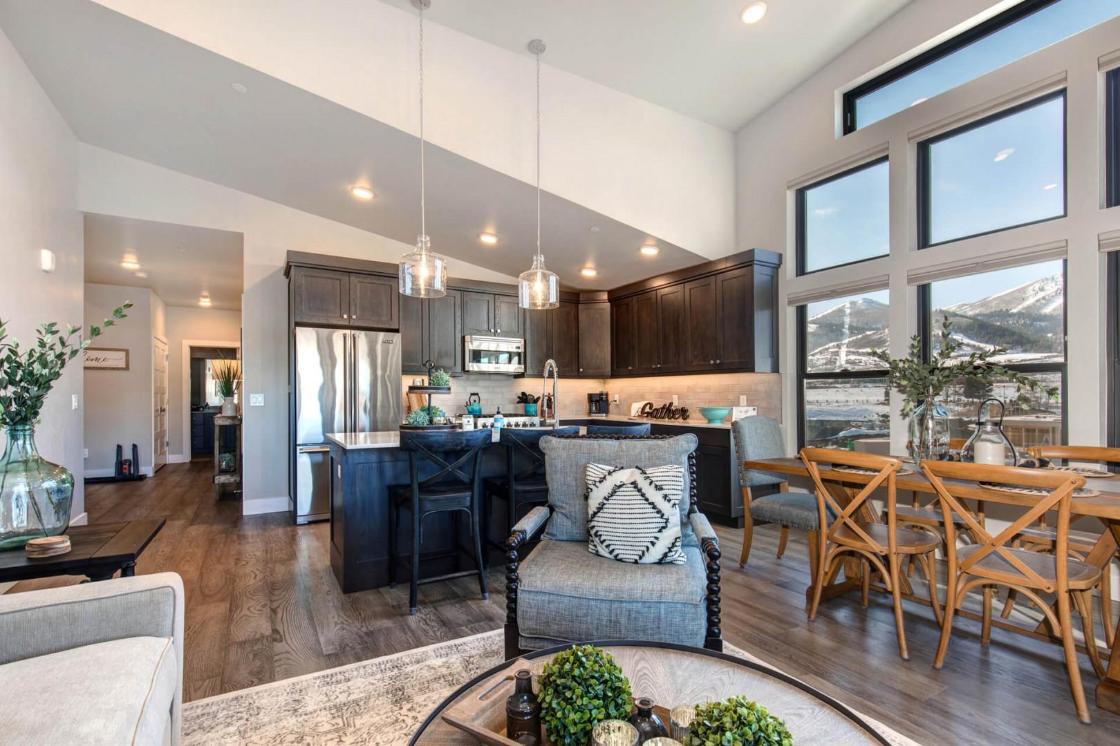 Cozy space with a stylish sofa set, dining table, and kitchen.