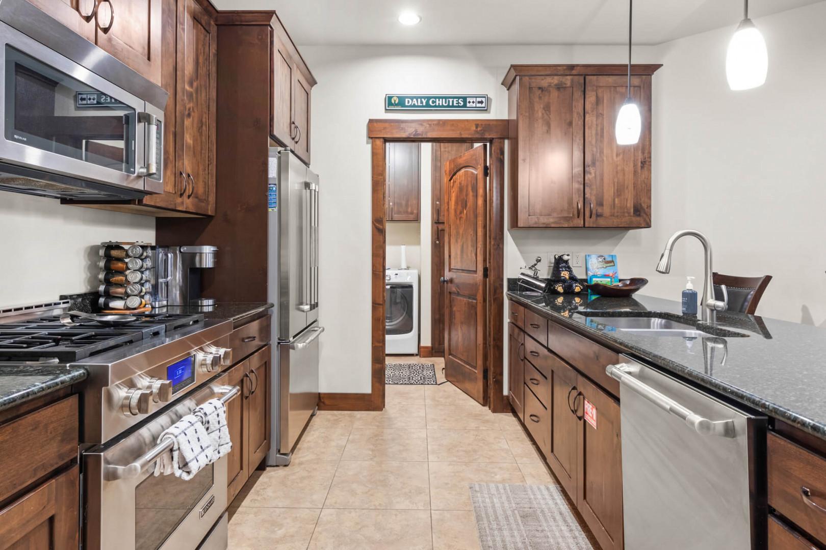 Your fully equipped kitchen features rich wood cabinets, granite counters, and everything you need to create memorable meals together.
