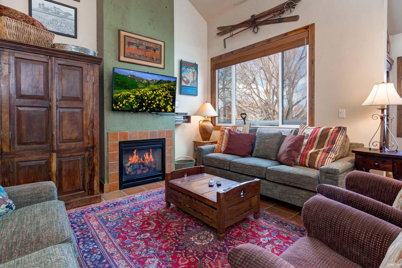 Cozy sofa set by the gas fireplace, overlooking the window and TV.