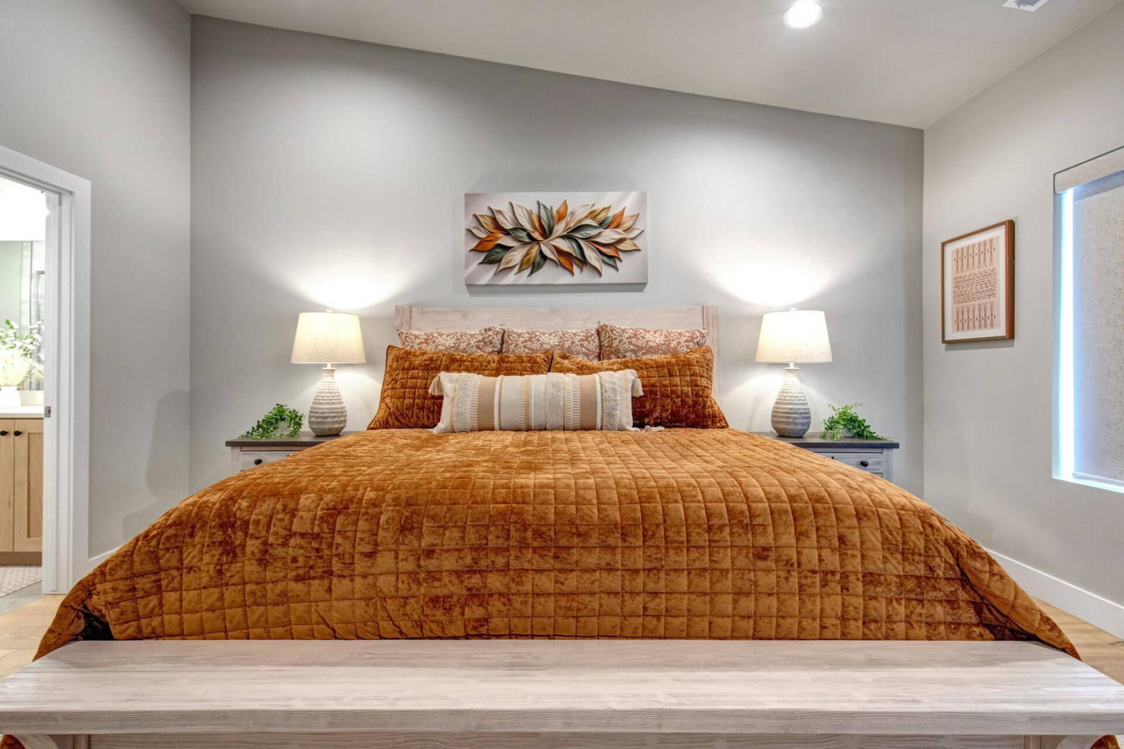 Sink into comfort on your plush bed, framed by warm lamps and soothing decor that invites deep, restful sleep.