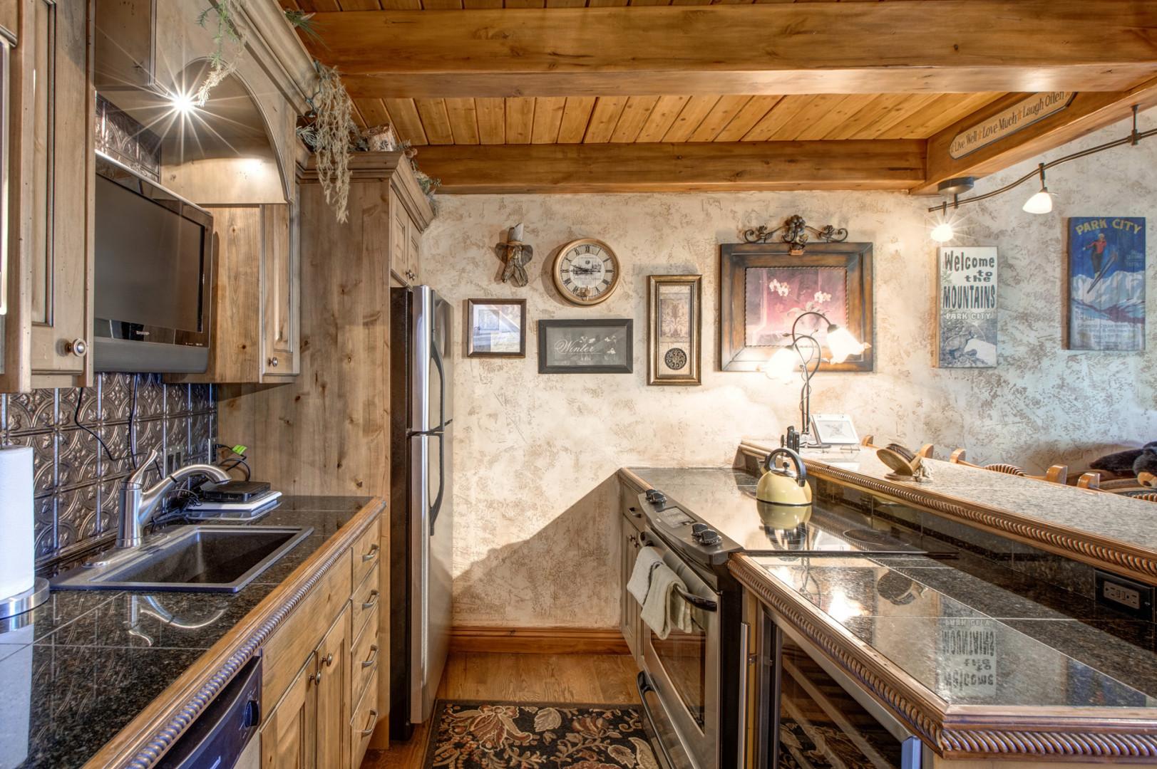 Modern appliances and ample storage in sleek kitchen design.