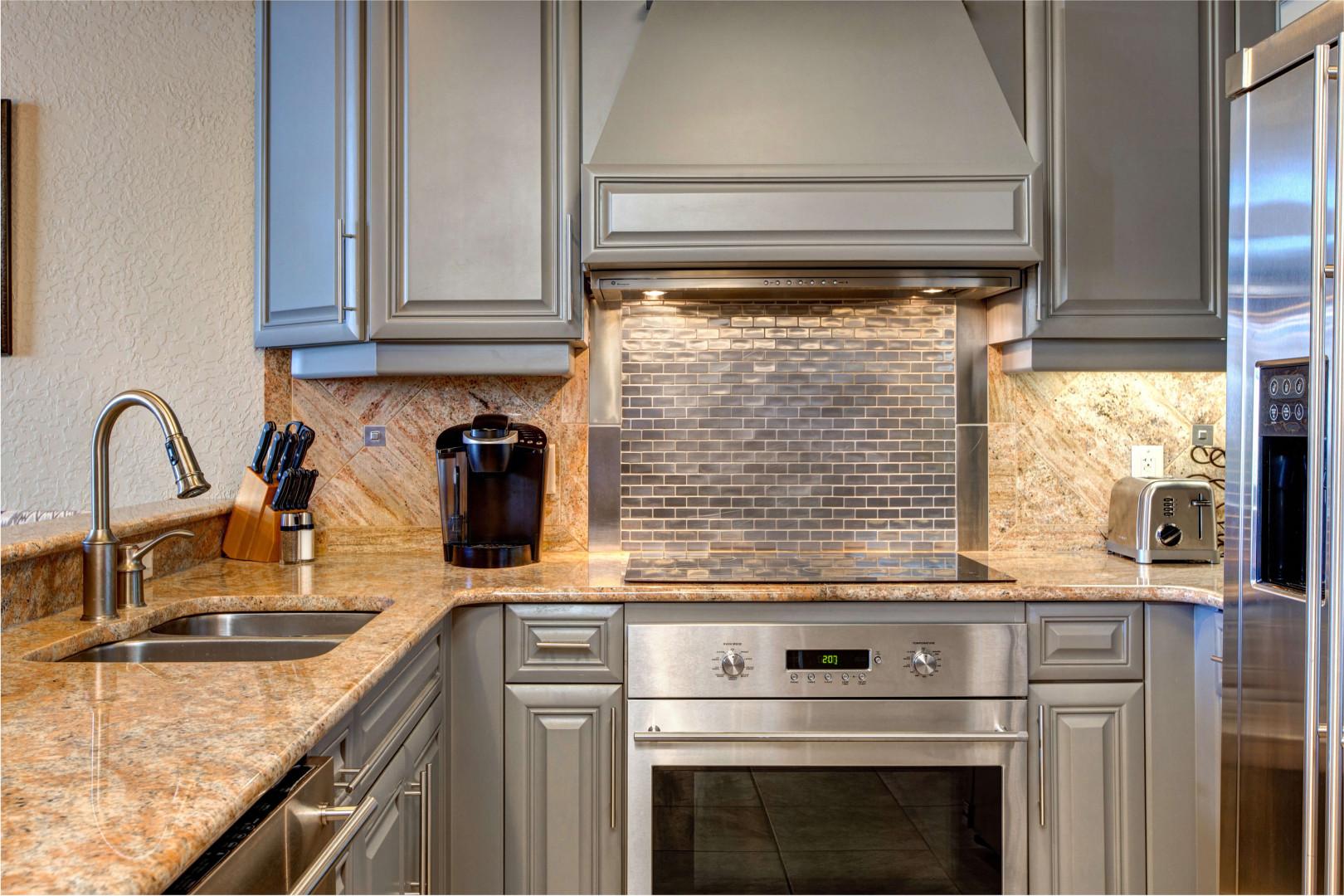 Modern appliances and ample storage in sleek kitchen design.